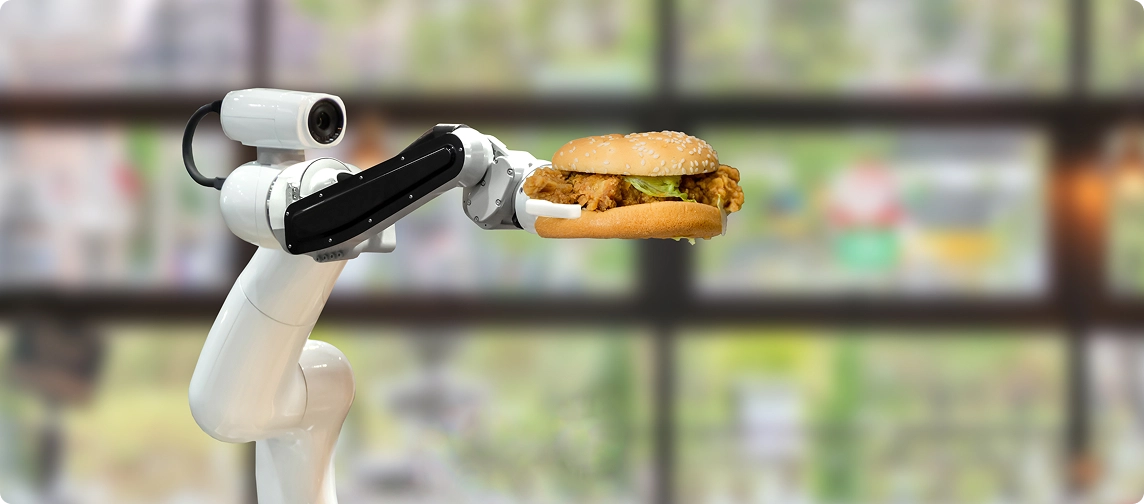 brazo robotico sosteniendo una hamburguesa